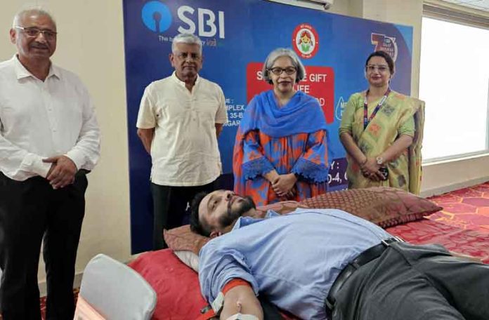 A donor donating blood during a camp organised by SBI in Chandigarh.