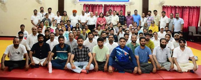Participants posing with dignitaries during concluding event of Refresher Course at Sports Training Centre, Nagrota.