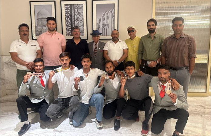 Athletes posing along with JKRS members.