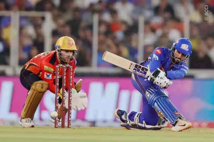 Tilak Varma playing a sweep shot during his innings of 44 runs against PBKS on Sunday.