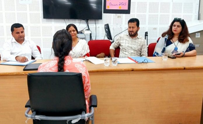 A job aspirant faces penalists during a placement drive at Govt College of Education Jammu.