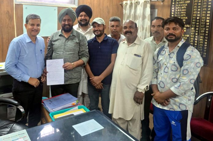 Senior Congress leader Taranjit Singh Tony submitting a charter of demands to SE PDD in Jammu.