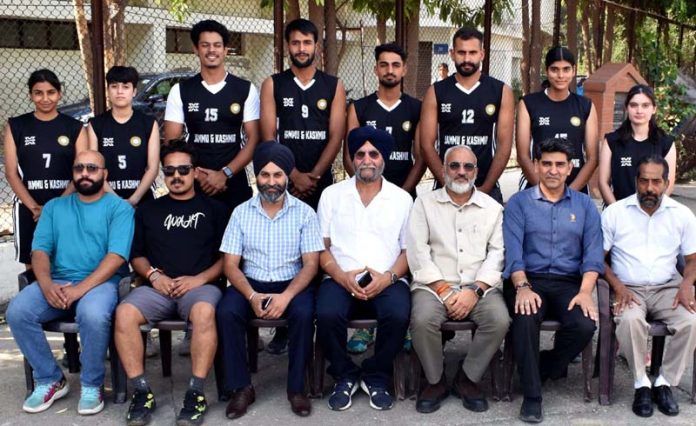 Dignitaries posing along with Basketball team at Jammu.