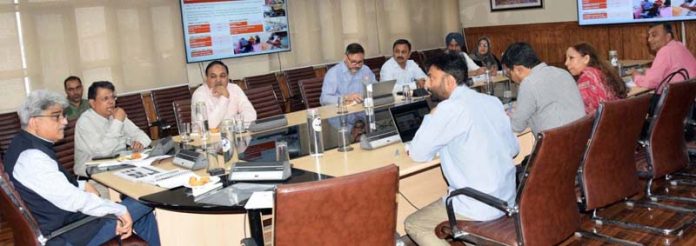 CS Atal Dulloo chairing a meeting at Srinagar on Tuesday.