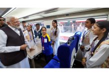 PM Narendra Modi interacting with the students on board the train.