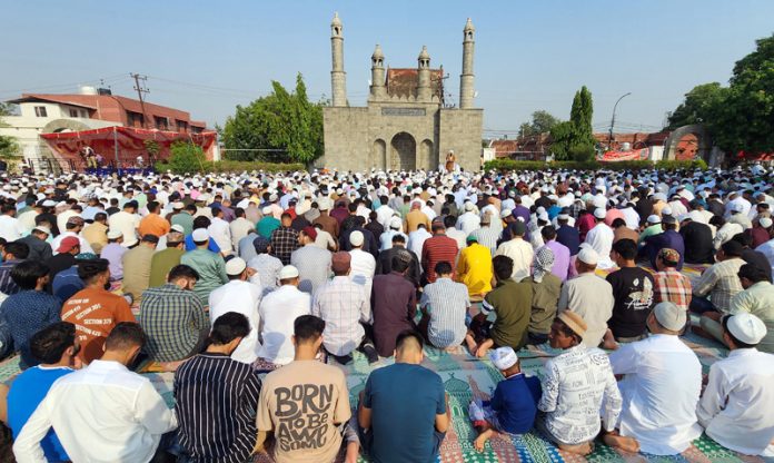 Muslims offering Namaz at the Eidgah near Residency Road in Jammu city on Saturday. -Excelsior/Rakesh