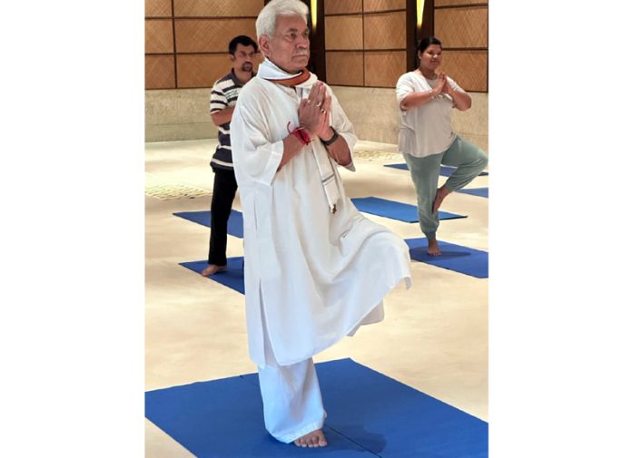 LG Manoj Sinha performing a Yoga Asana on 11th International Yoga Day at Srinagar on Saturday.