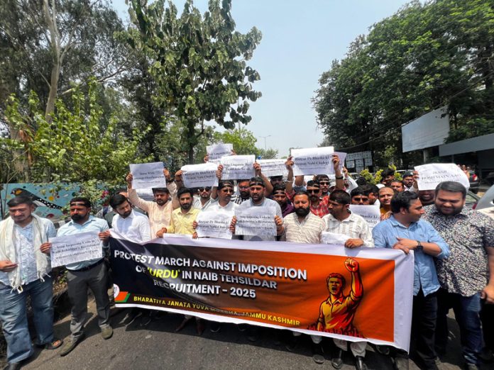 BJYM activists taking out protest march at Jammu on Friday.