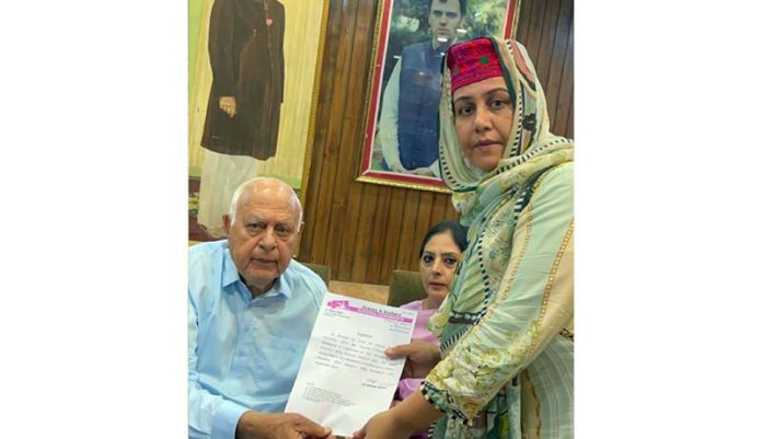 NC chief Dr Farooq Abdullah handing over appointment letter to NC’s Women’s Wing candidate.