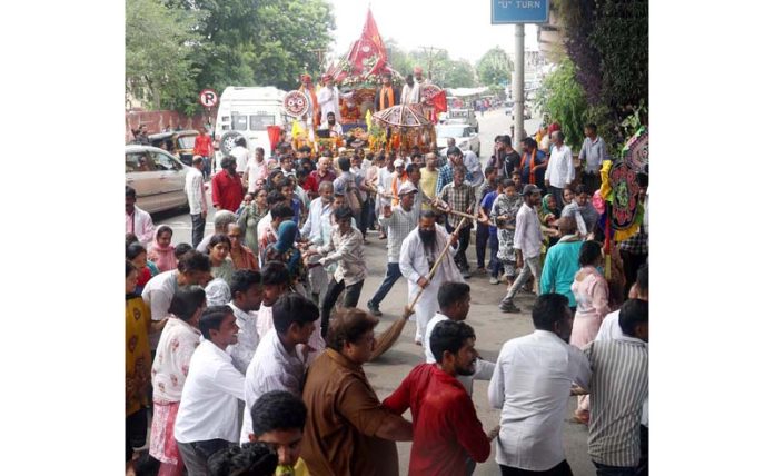 Devotees during the Rath Yatra of Lord Jagannath Ji in Jammu on Friday. -Excelsior/Rakesh
