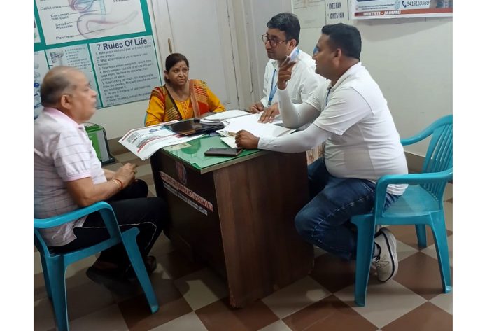 A doctor examining a patient during a Neurotherapy camp in Jammu on Sunday.