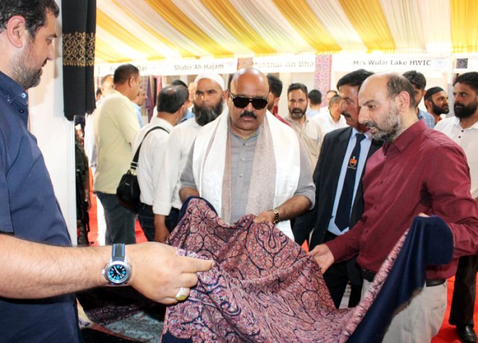 DyCM Surinder Choudhary inspecting a stall at Hathkargha Mela at Srinagar on Wednesday.