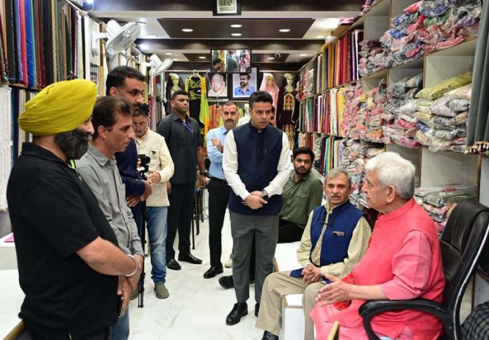 Lieutenant Governor Manoj Sinha interacting with traders at Lal Chowk, Srinagar on Tuesday.