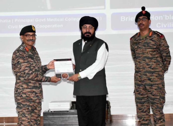 GMC Rajouri Principal Dr AS Bhatia being honoured by the Army Commander on Friday.