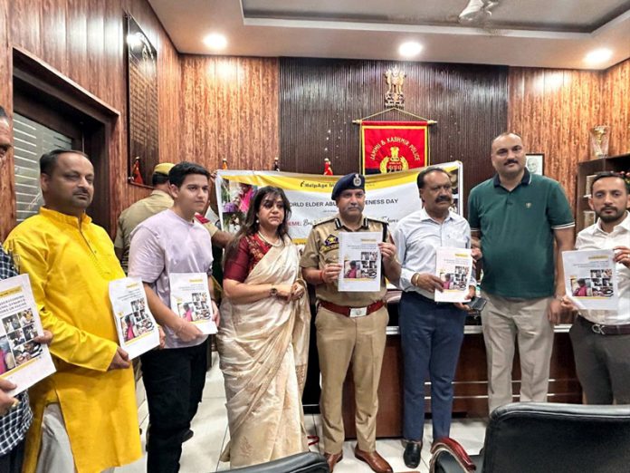 DIG JSK Range, Shiv Kumar Sharma releasing HelpAge India's annual report in Jammu on Sunday.