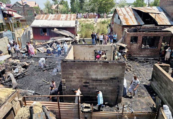 Destruction caused by fire in Pamposh Colony area of Srinagar on Wednesday. -Excelsior/Shakeel Destruction caused by fire in Pamposh Colony area of Srinagar on Wednesday. -Excelsior/Shakeel