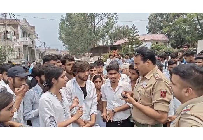 Police trying to pacify protesting students at Rajouri. -Excelsior/Imran Police trying to pacify protesting students at Rajouri. -Excelsior/Imran