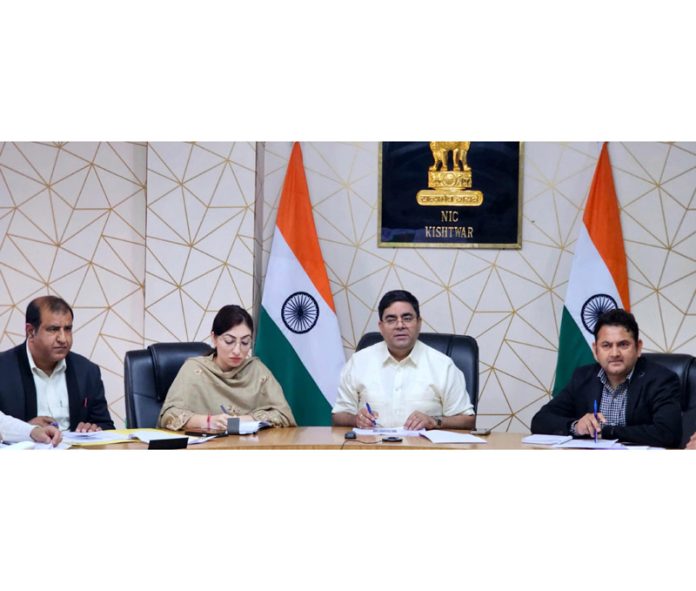 DDC Kishtwar chairing a meeting on Sunday.