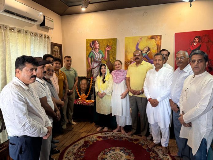 Dignitaries posing for a photograph after paying tribute to the legendary artist Master Sansar Chand Baru on his death anniversary.