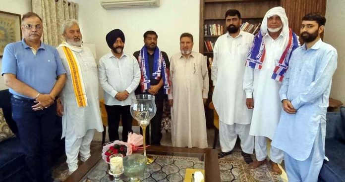 Bodh Raj Bhagat being welcomed in Apni Party by Party chief and others.