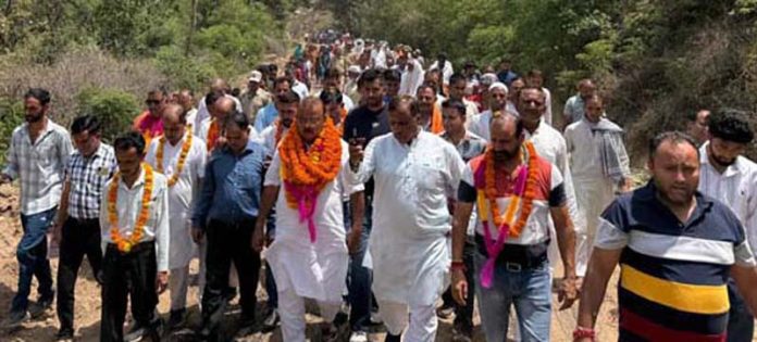 MLA Chander Prakash Ganga inaugurating construction work of a road in Vijaypur. MLA Chander Prakash Ganga inaugurating construction work of a road in Vijaypur.