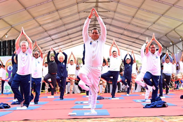 Uttarakhand CM performing yoga asana on Saturday. Uttarakhand CM performing yoga asana on Saturday.