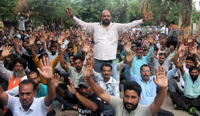 PDD workers staging protest dharna in Jammu on Friday. -Excelsior/Rakesh