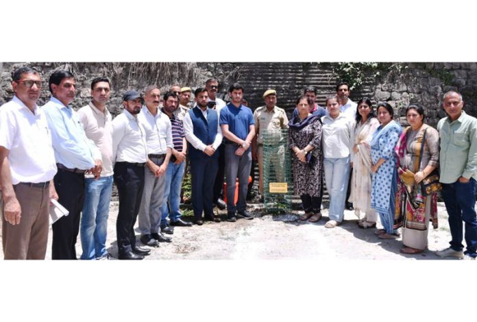 DC Rajouri Abhishek Sharma along with district administration and family members of martyr Dr Raj Kumar Thapa during a condolence ceremony.