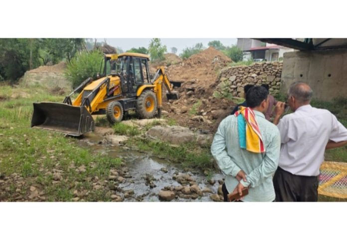 JCB in action for restoring a drinking water body area in Sunderbani. JCB in action for restoring a drinking water body area in Sunderbani.