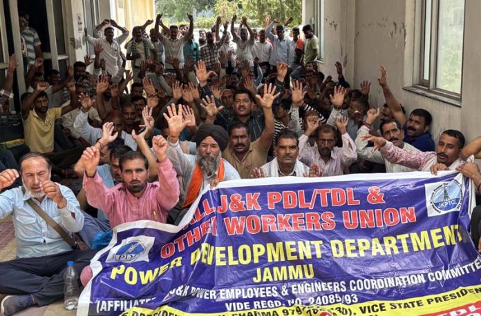 Power workers staging protest dharna near Panama Chowk in Jammu. -Excelsior/Rakesh Power workers staging protest dharna near Panama Chowk in Jammu. -Excelsior/Rakesh