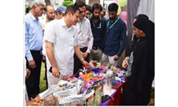 Minister Javid Dar inspecting a stall at HP&M Buyer-Seller meet on Thursday.