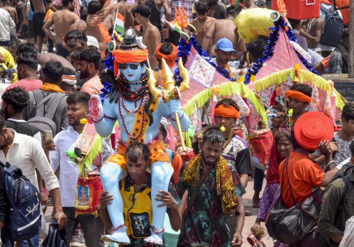 Kanwar Yatra 2025 in Haridwar ‘Kanwariyas’, Lord Shiva devotees, carry holy water during ‘Kanwar Yatra’ in the holy month of ‘Shravan’, at Har Ki Pauri, in Haridwar.