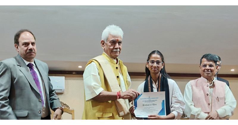 LG Manoj Sinha felicitating a student at IUST Awantipora on Thursday.