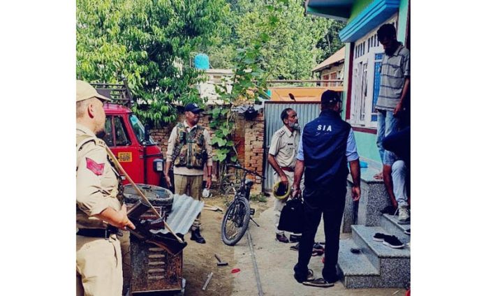 SIA sleuths during raid in a house at Bijbehara, Anantnag. SIA sleuths during raid in a house at Bijbehara, Anantnag.