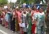 Shri Amarnath Ji pilgrims in long queues in front of a registration counter at Jammu on Friday. - Excelsior/Rakesh