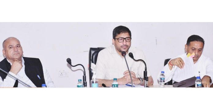 DDC Chairman Naseem Liaqat chairing the meeting in Rajouri on Thursday.