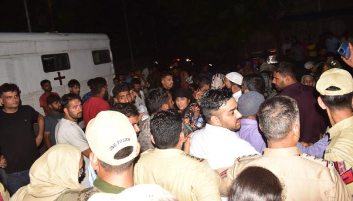 Family members of the deceased youth protesting outside GMC Jammu on Thursday. -Excelsior/Rakesh