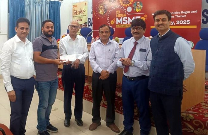 Lalit Mahajan, president of BBIA distributing loans among customers during a camp in Samba.