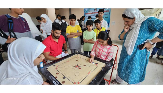Players in action during Carrom match in Srinagar.