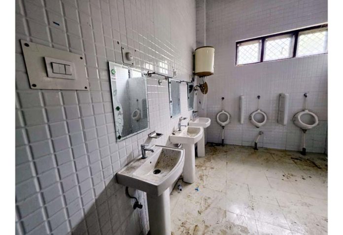 A view of neglected washroom inside Baramulla Indoor Sports Stadium. -Excelsior/Aabid Nabi A view of neglected washroom inside Baramulla Indoor Sports Stadium. -Excelsior/Aabid Nabi