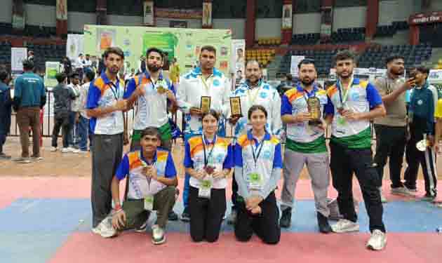 J&K Kickboxing team posing along with medals. J&K Kickboxing team posing along with medals.