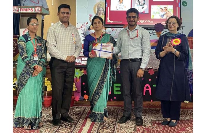 Faculty of different schools posing along with dignitaries during a programme. Faculty of different schools posing along with dignitaries during a programme.