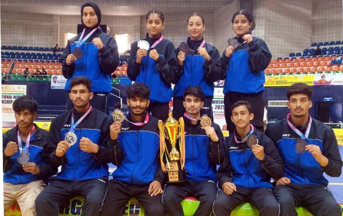 J&K Junior Wushu team posing along with medals and trophy. J&K Junior Wushu team posing along with medals and trophy.