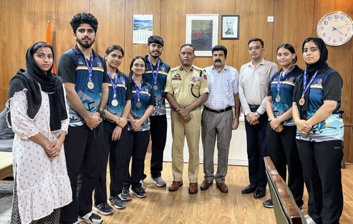 IGP Jammu Zone Bhim Sen Tuti posing along with athletes.