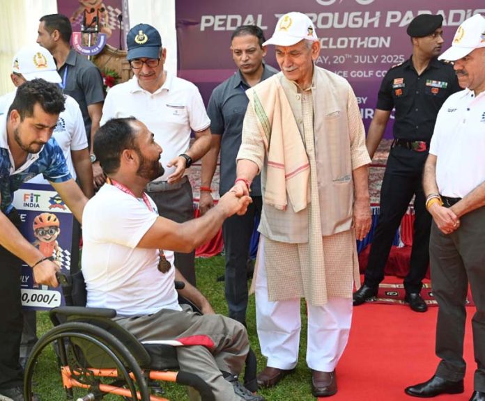 LG greeting a specially abled cyclist at Srinagar on Sunday. LG greeting a specially abled cyclist at Srinagar on Sunday.