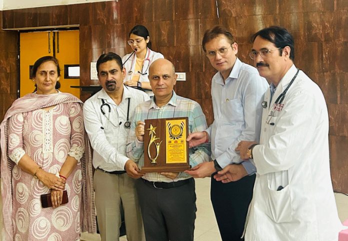 Doctors honouring Principal GMC Jammu Dr Ashutosh Gupta during a seminar at SMGS Hospital. Doctors honouring Principal GMC Jammu Dr Ashutosh Gupta during a seminar at SMGS Hospital.