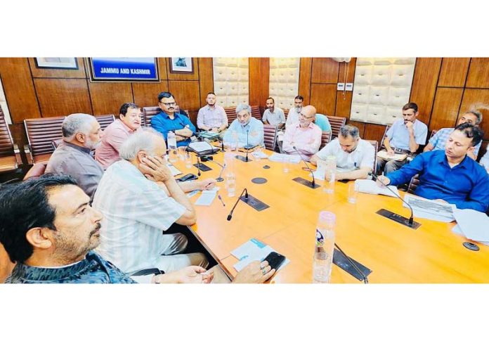 Ministers Javed Rana and Javed Dar reviewing irrigation scenario in J&K on Wednesday.