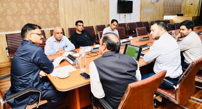 Minister Javed Rana chairing a meeting at Srinagar on Thursday. Minister Javed Rana chairing a meeting at Srinagar on Thursday.