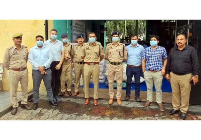 Jammu and Kashmir Narcotics Control Bureau team who destroyed 20 quintals of narcotics, including capsules, ganja (opium), poppy straw, charas (cannabis), intoxicant syrups, heroin (10.505 Kg), worth Rs 40 crores at Anmol Healthcare, Rara, Ramgarh, in Samba on Wednesday. -Excelsior/Pardeep Sharma