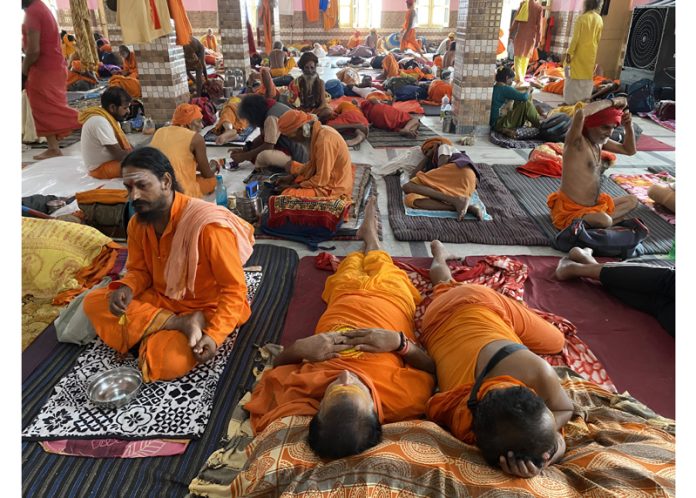 Shri Amarnath Ji bound Sadhus taking rest at Ram Mandir, Purani Mandi in Jammu on Tuesday. — Excelsior/Rakesh